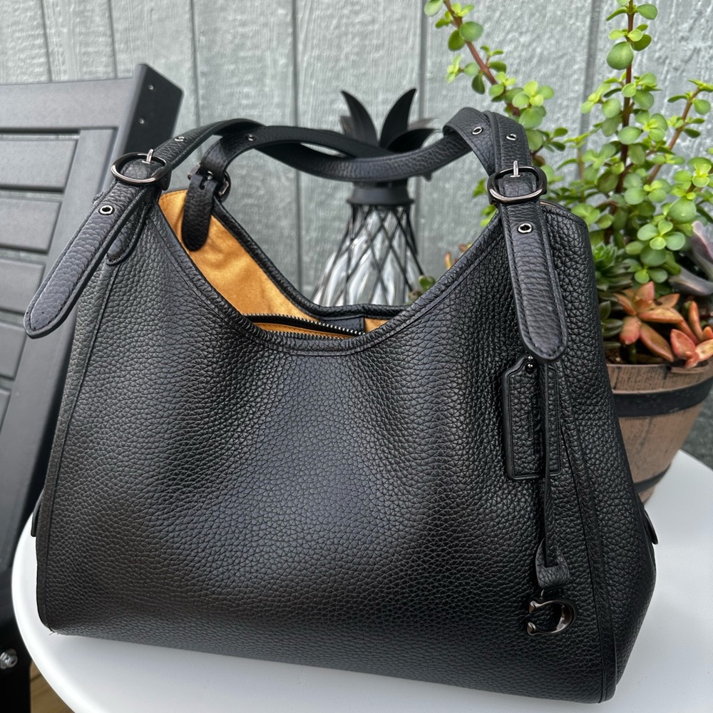 Authentic Coach Lori shoulder bag used a couple of times in brand new condition.